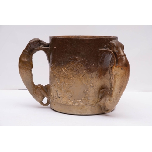 6 - A 19th century stone ware hunting tyg with sprigged decoration to body and relief moulded greyhound ... 