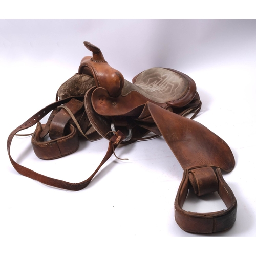 60 - A brown leather Western style saddle, 55cm long.