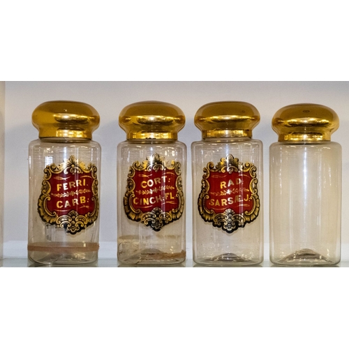 469 - A set of four early 20th century apothecary jars,  each of cylindrical form  with gold lacquer cover... 