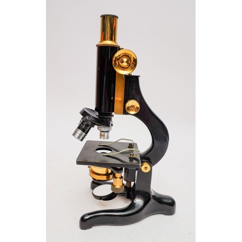 474 - A black lacquer 'Kima' microscope by Watson & Son, London: No. 58046. coarse and fine adjust focus, ... 