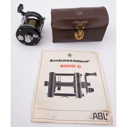 606 - An Abu Ambassadeur 6000 C Multiplier reel in leather case with accessories and instruction booklet, ... 