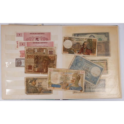 764 - A stamp album containing a collection of World banknotes: including three Tibetan strany notes, Indi... 