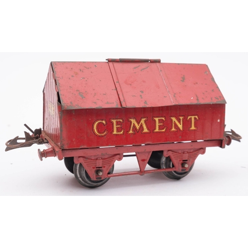 974 - An unboxed group of Hornby O gauge rolling stock,  comprising a Cement wagon, 'Coleman's Mustard' bo... 