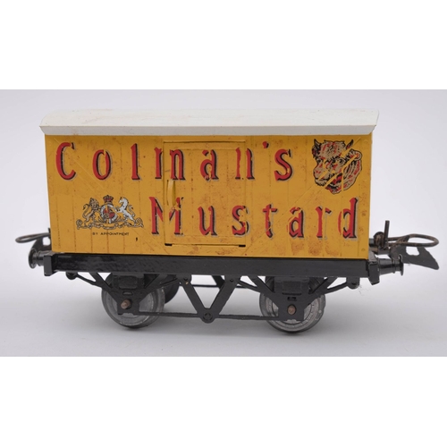 974 - An unboxed group of Hornby O gauge rolling stock,  comprising a Cement wagon, 'Coleman's Mustard' bo... 