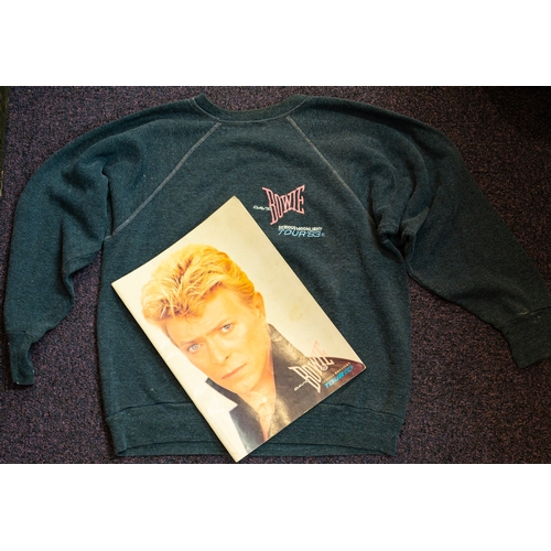 1064 - David Bowie. A 1983 'Serious Moonlight' Tour programme and sweat shirt.