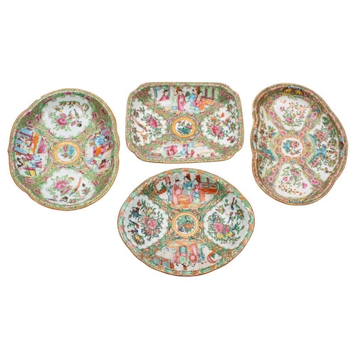 99 - A group of four Canton shaped dishes, Qing Dynasty two of scallop form, 27.5cm [one chipped]; one re... 