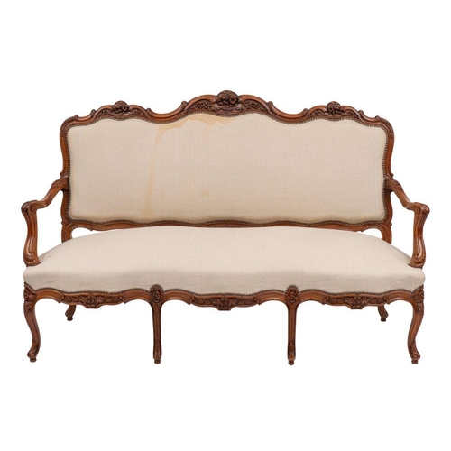 1074 - A suite of  carved walnut and cream fabric upholstered salon furniture in Louis XV style, 20th centu... 