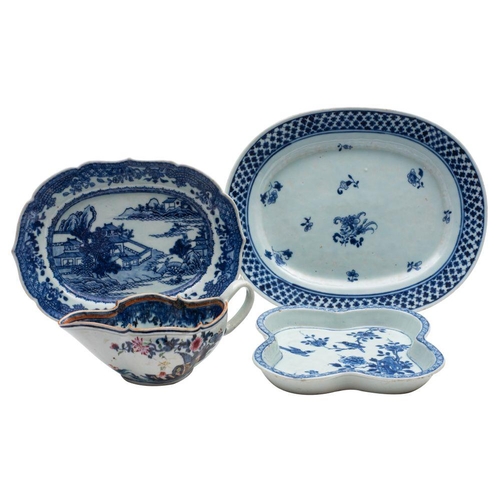 131 - A mixed lot of three Chinese blue and white dishes and an underglaze blue and famille rose sauceboat... 