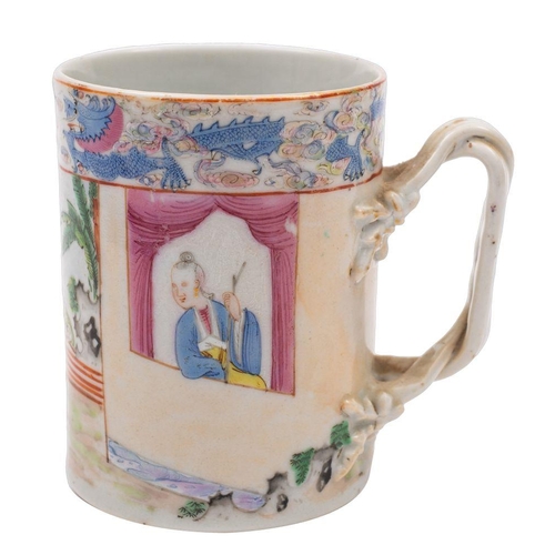 134 - A Chinese famille rose cylindrical mug with crossover branch handle, painted with two figures dancin... 