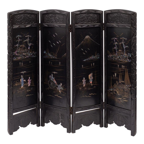 1345 - A Japanese carved, black lacquered and mother-of-pearl inset four fold screen, circa 1900; the leave... 