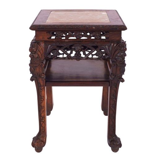 1355 - A Chinese carved and stained hardwood and marble mounted stand, late 19th century; of square section... 