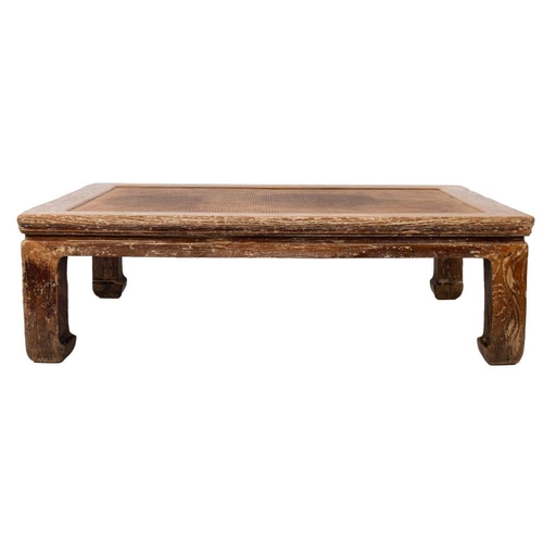 1359 - A Chinese hardwood and rattan low table, 20th century; the cleated rectangular top with moulded edge... 