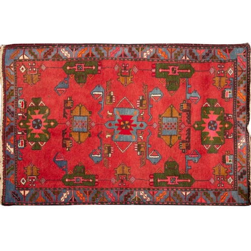 1362 - A Hamadan rug,  the wine field with geometric medallions and designs enclosed by a main powder blue ... 