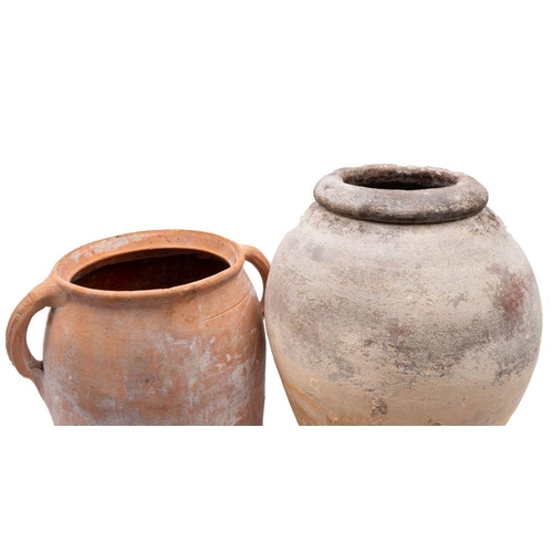 1399 - Two terracotta garden pots,  the first of oviform with rolled rim the other of tapering cylindrical ... 