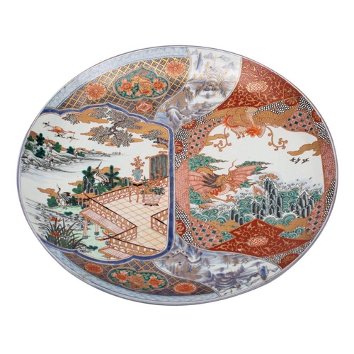 147 - A pair of Japanese Arita porcelain chargers, of generous proportions each decorated in underglaze bl... 