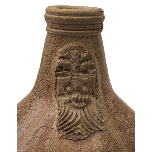 155 - A stoneware Bartmann krug or Bellarmine jug, of typical bellied form with ribbed handle the neck app... 