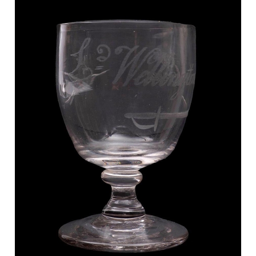 16 - A small toasting glass, the oviform bowl engraved with a sword and the caption 'Ld. Wellington for E... 