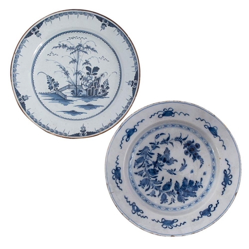 173 - A mixed lot of Dutch delftware comprising four blue and white chargers and a plate variously painted... 