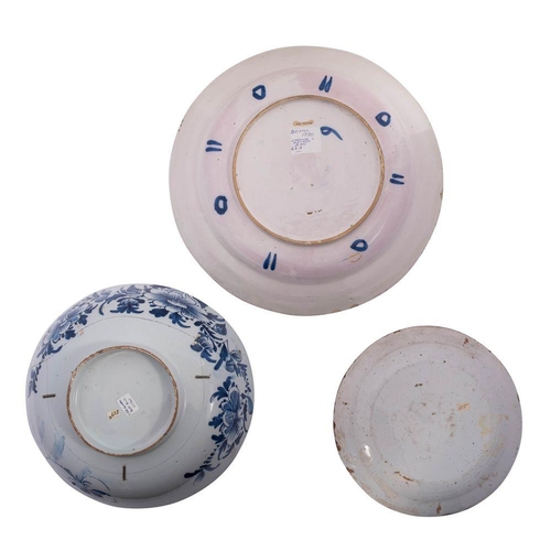 176 - Three pieces of 18th century English delftware comprising a polychrome charger painted in the orient... 