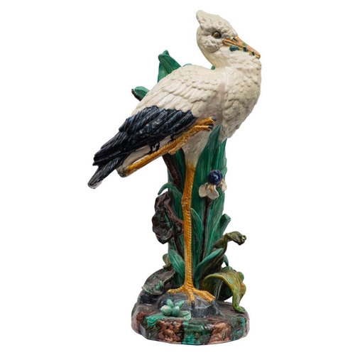 184 - A Joseph Holdcroft majolica stick stand in the form of a stork with bullrushes and iris growing from... 