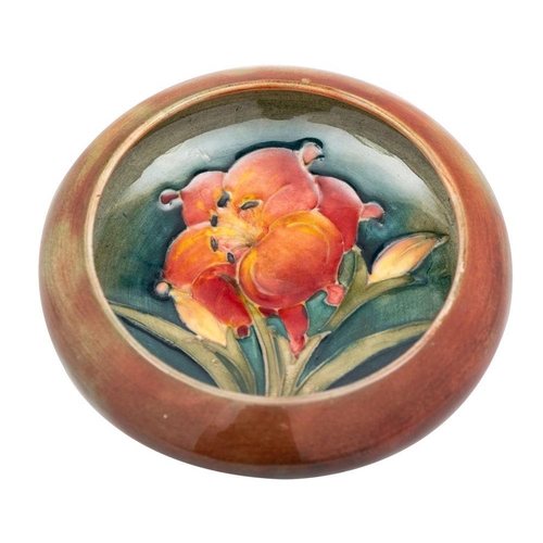 190 - A Moorcroft pin tray the interior and exterior tube lined in the Spring flowers pattern, impressed M... 