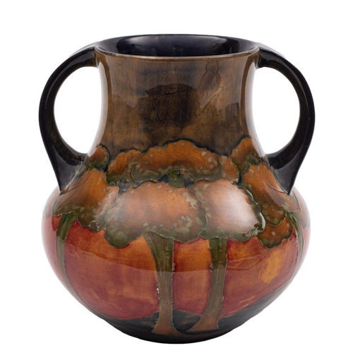 192 - A William Moorcroft twin-handled vase tube lined and decorated in the 'Eventide' pattern with a cont... 