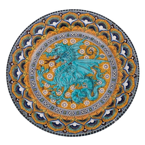 213 - An Italian majolica charger by C Norelli decorated in bright enamels with a dragon medallion within ... 