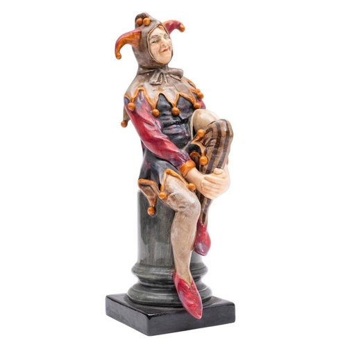 220 - A Royal Doulton figure, The Jester HN.1702, together with a wooden base.