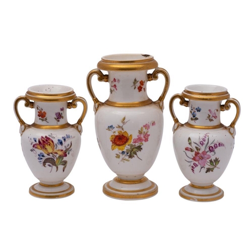 239 - A garniture of three porcelain two handled vases,  probably Coalport, of footed oviform with raised ... 