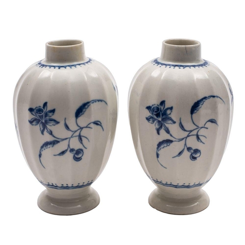 242 - A pair of First Period Worcester blue and white tea canisters of baluster fluted form painted in the... 