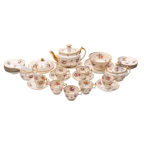 304 - An extensive Spode porcelain part tea service painted with floral sprays and sprigs on a gilt dot gr... 