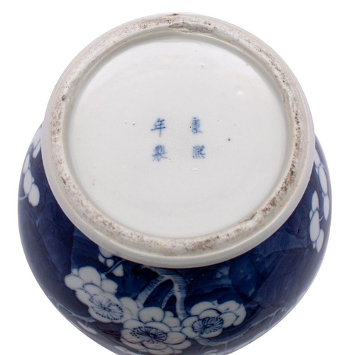 31 - A mixed group of Chinese porcelains, primarily blue and white comprising a prunus decorated baluster... 