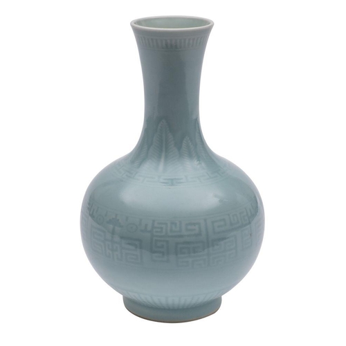 47 - A Chinese bottle vase the pale greenish-blue glaze decorated with stiff plantain leaves, diaper and ... 