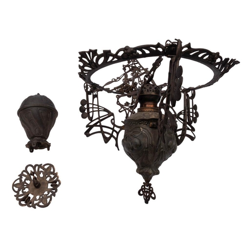 477 - A cast and repousse worked metal rise and fall pendant oil lamp, in Art Nouveau taste, early 20th ce... 