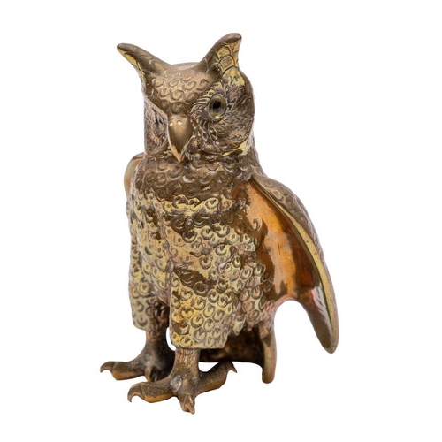 541 - A Sri Lankan brass and glass-inset model of a long-eared owl, 20th century, modelled standing, the u... 