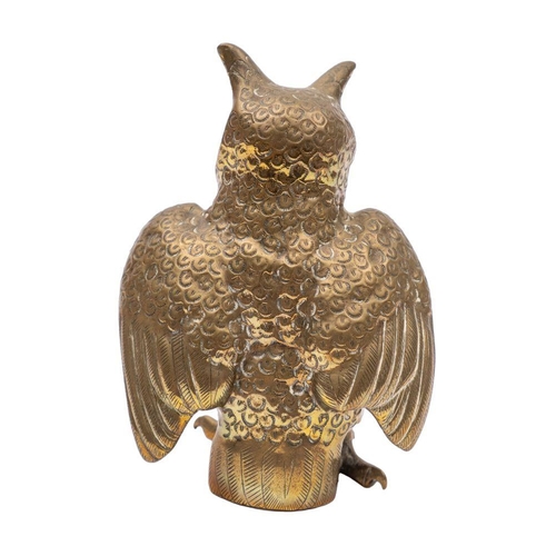 541 - A Sri Lankan brass and glass-inset model of a long-eared owl, 20th century, modelled standing, the u... 