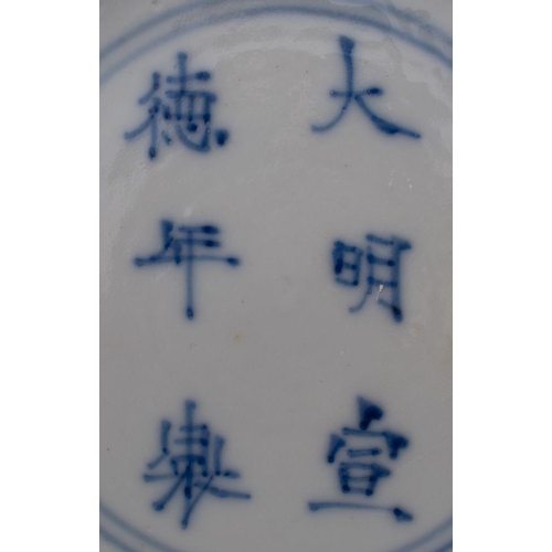 55 - Two Chinese blue and white 'klapmuts' bowls, Kangxi the first painted with prunus blossom, the rim w... 