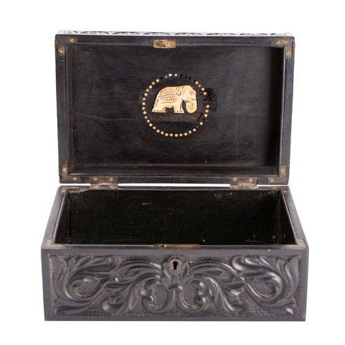 551 - A Sri Lankan carved ebony and bone inset casket, 19th century, of hinged rectangular form, the hinge... 