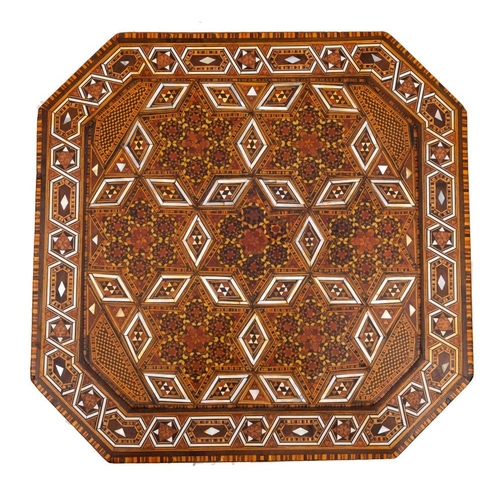 552 - A Syrian parquetry octagonal hinged casket inlaid overall with complex geometric mosaic designs, the... 