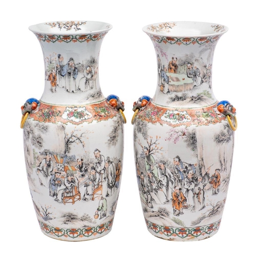 56 - A pair of Chinese famille rose vases of baluster form with waisted necks and Buddhist lion mask ring... 