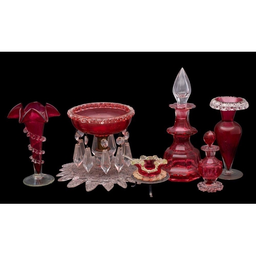 6 - A mixed group of cranberry glass, comprising a footed bowl hunt with pendants, two vases, two table ... 