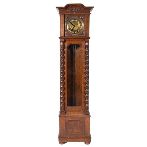 689 - An Edwardian German oak longcase clock having a weight-driven movement striking the hours on two gon... 