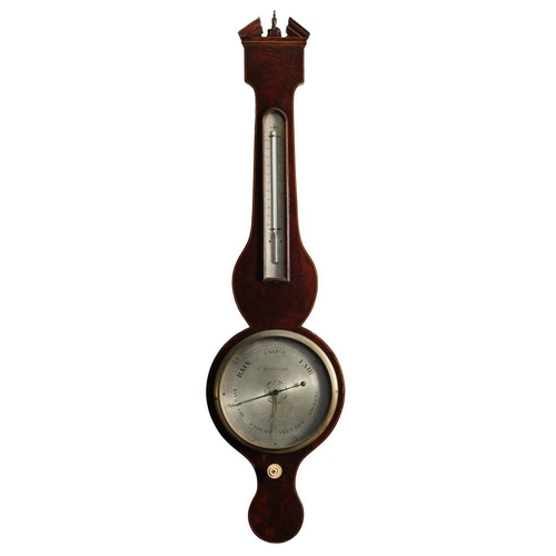 693 - A mahogany wheel barometer the eight-inch round silvered dial engraved with usual barometer markings... 