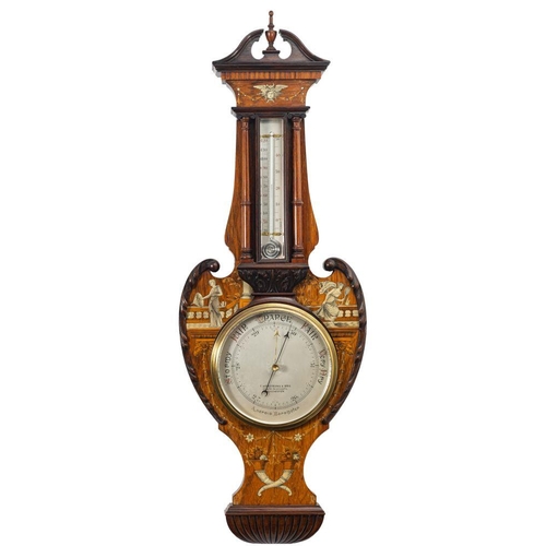 694 - A substantial rosewood and marquetry inlaid aneroid barometer: the round silvered dial engraved with... 