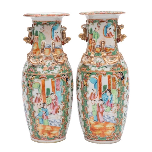 80 - A pair of Canton baluster vases with applied gilt lion dog handles, the shoulders with similar chilo... 