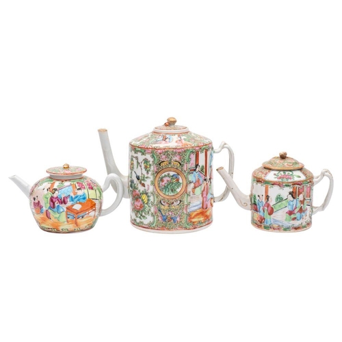 95 - A group of three Canton teapots and covers, Qing Dynasty two of cylindrical form [one with chip to c... 