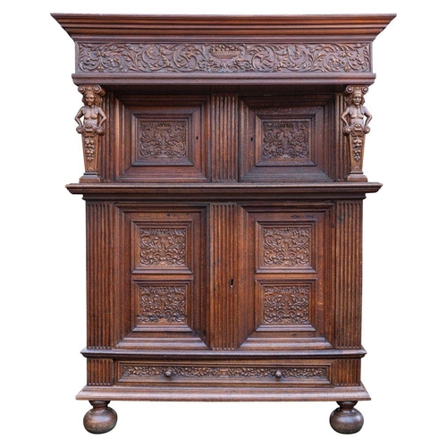 991 - A Flemish oak court cupboard in 17th century style, 19th century; with double ogee and stepped corni... 