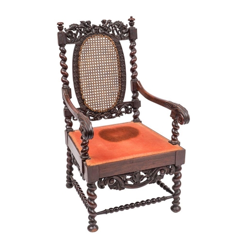 994 - A Charles II walnut and canework elbow chair, circa 1680; the backrest toprail openwork carved with ... 