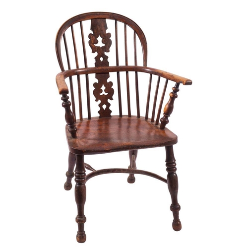 999 - A late George III yew wood and elm Windsor elbow chair, early 19th century; the arched backrest with... 