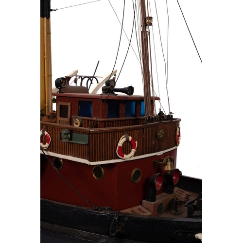 410 - A scale model of the tug 'Tanga':  fitted black banded cream stack , aerial masts, bridge lifeboats ... 